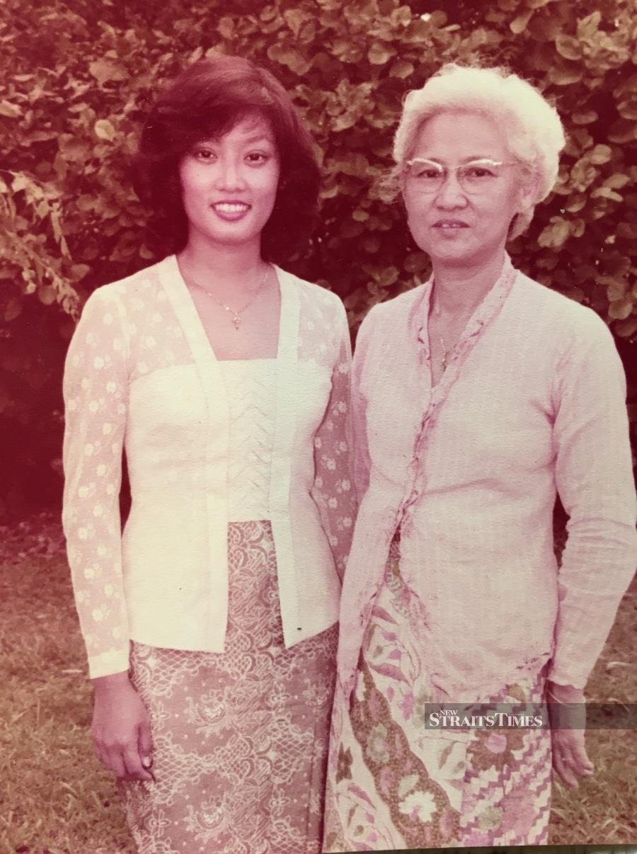  Su Kim and her late mother, Mrs Lee Koon Liang, captured during the former's Master's in Education convocation.