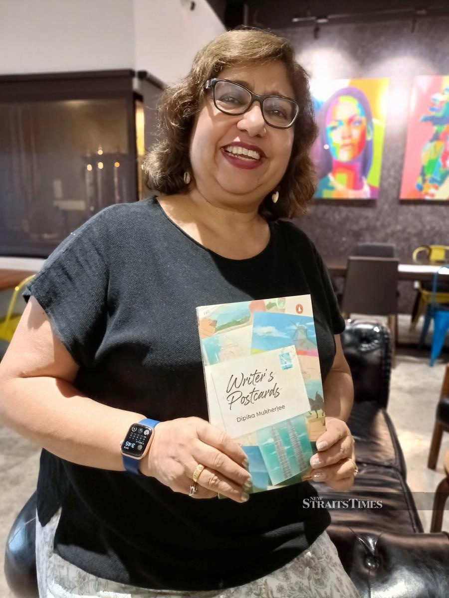  The author with her latest book, Writer's Postcards.