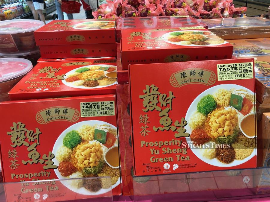  Boxes of supermarket-sold Yee Sang to toss in a new year.