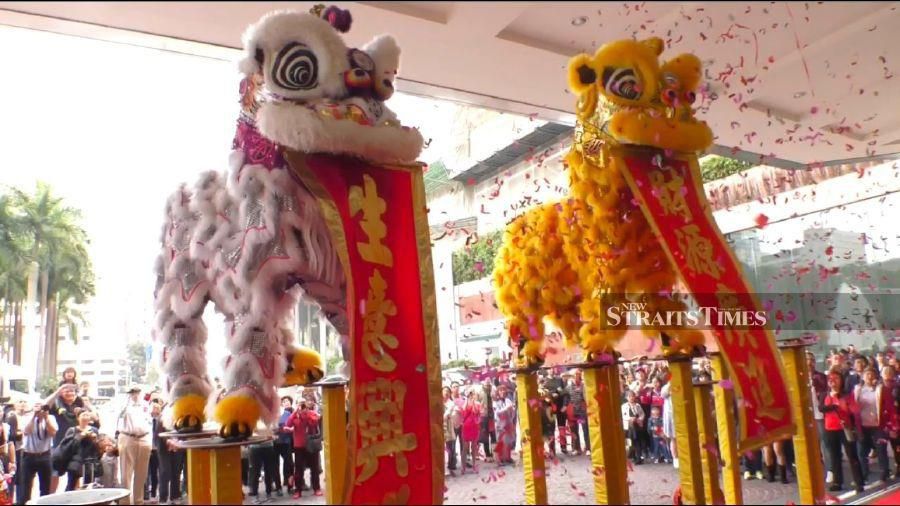  Traditional lion dance to bring good luck and chase away evil spirits.