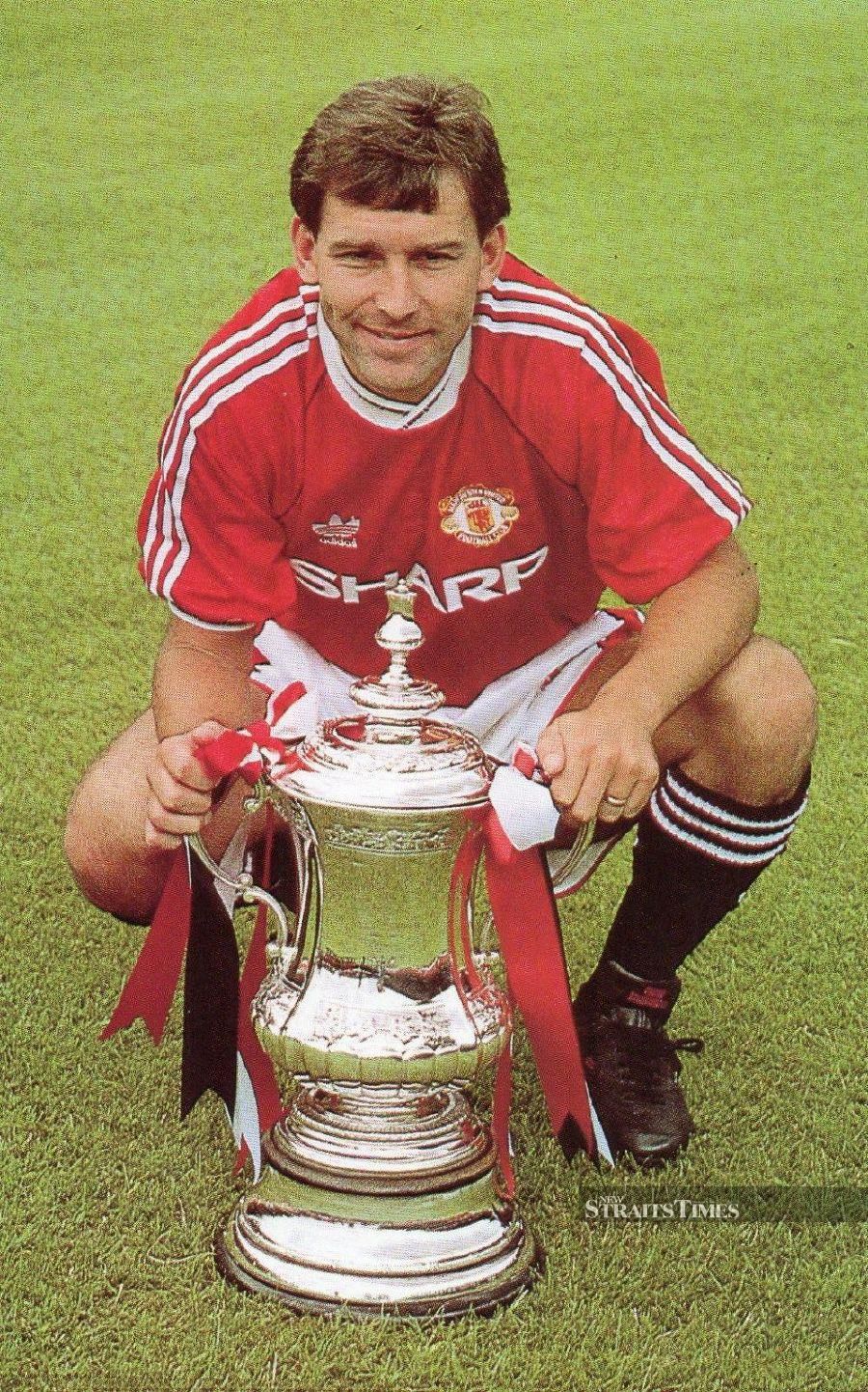  United legend, Bryan Robson. Source from Pinterest.