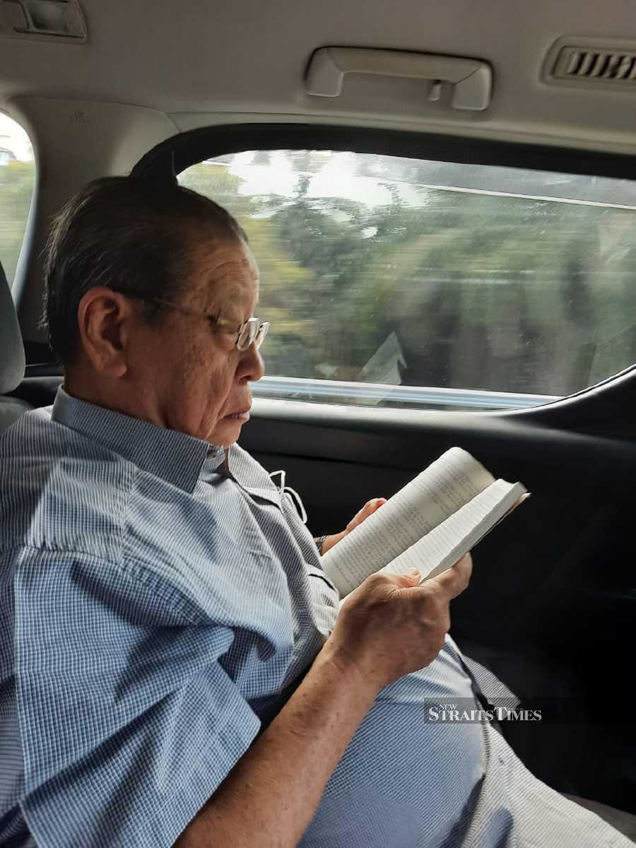  The political stalwart reading Kee's book.