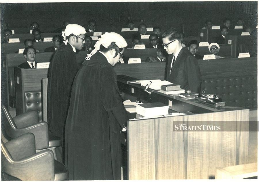  Lim Kit Siang being sworn in as member of Parliament.