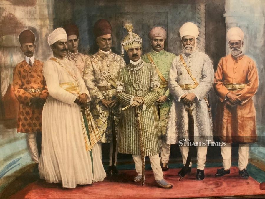  The last Nizam of Hyderabad (centre) at his coronation in 1911 wearing a small amount of his finery.