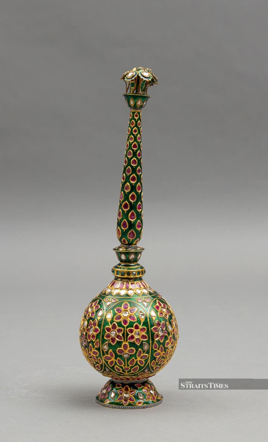  Rarely have rosewater sprinklers been as lavish as this 18th-century example in enamel with gemstones. Courtesy of Islamic Arts Museum Malaysia.