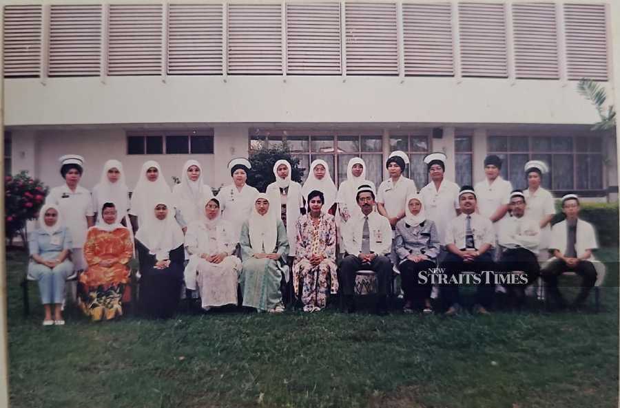  Sharifah Sulaiha (seated, fourth from right), during her first posting at the Kuala Terengganu Hospital in 1998.