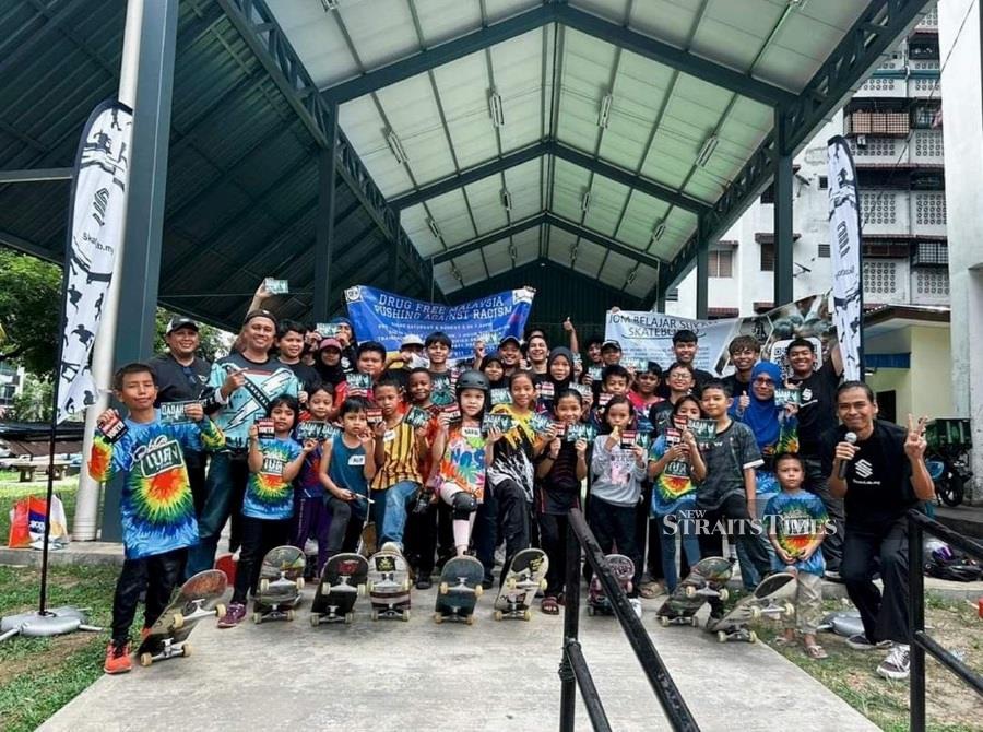  Conducting skateboarding lessons at the People Housing Project in Setapak, Kuala Lumpur.