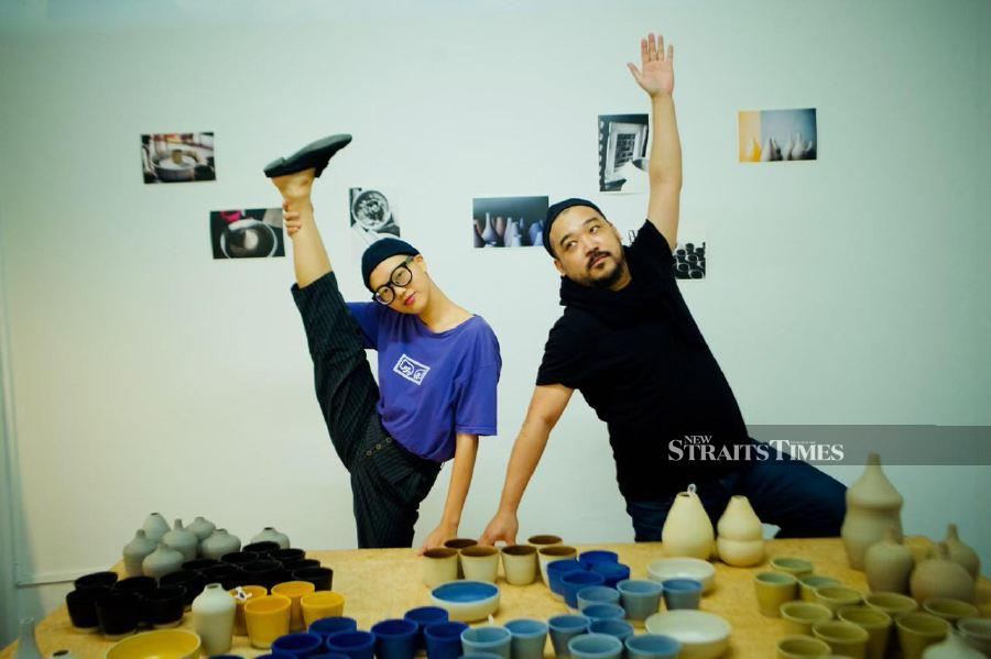  Tan and the curator, Lian Kian Lek at the exhibition 'What if the world is made of clay' in 2020.