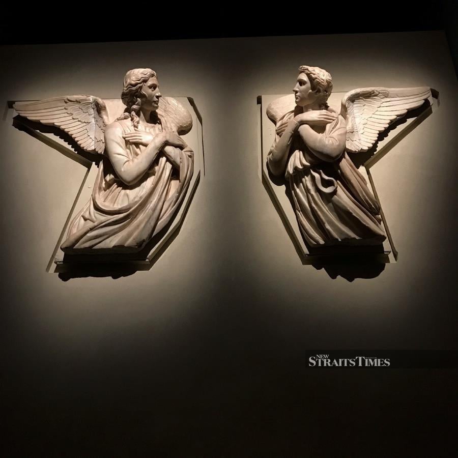  The drama of two angels by Donatello's Florentine contemporary Michelozzo di Bartolomeo.