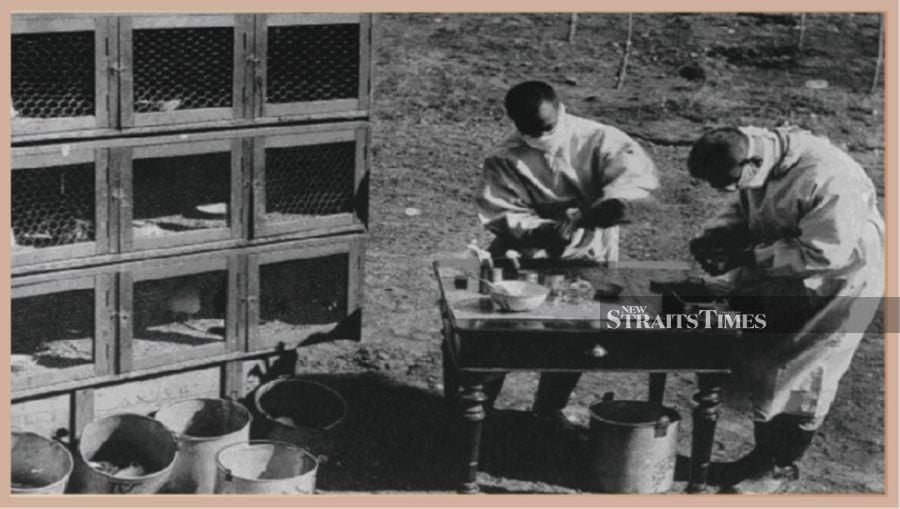  Dr Wu (left) conducting plague experiment with colleague in the open field, 1921.