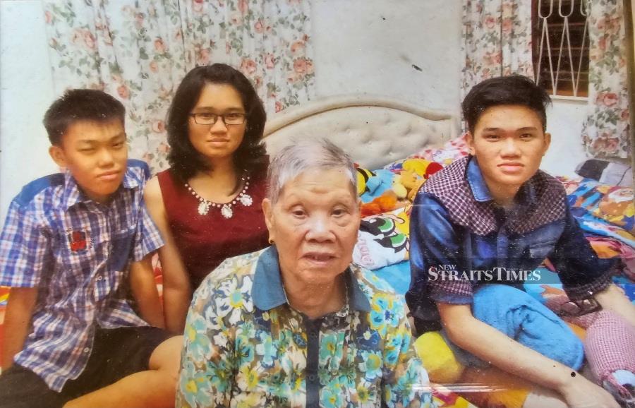  The writer's mum with her grandchildren , in a picture taken sometime in 2015.