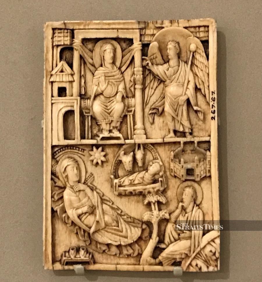  In this German ivory plaque from a thousand years ago, Mary's shoes are neatly arranged on a nearby stool.