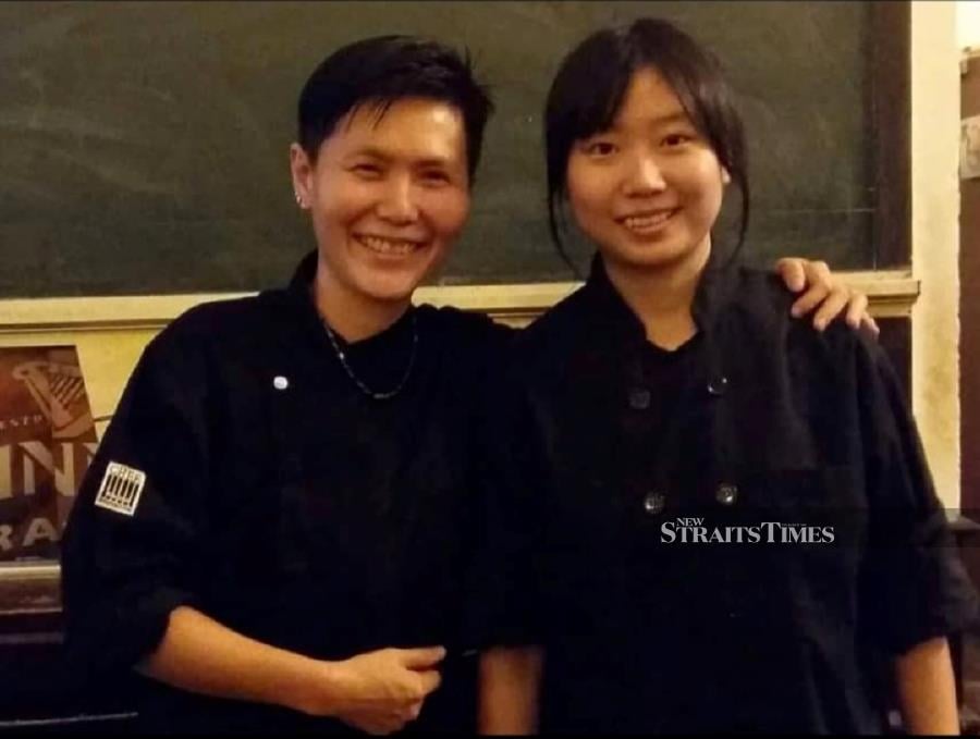  Chef Yenni (left) and her young protege, Shelly, in the early days together at Meatology.