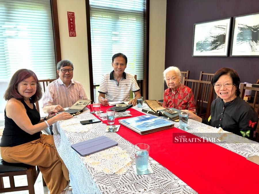 The writer (third from left) with Chow (in red), her sister Rosaline (right) with Chow's second son Dr Ronald and daughter Chee Koon (far left).