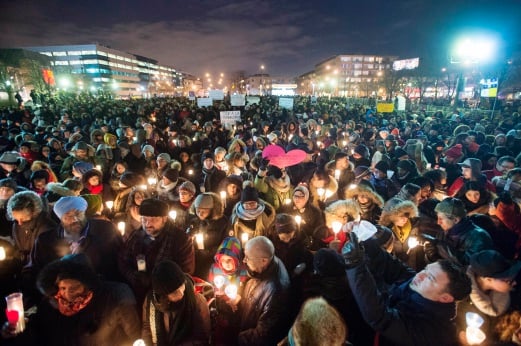 (File pix) People hold candles for victims of Sunday's deadly shooting at a Quebec City mosque, during a vigil in Montreal on Monday, Jan. 30, 2017. Alexandre Bissonnette, a French Canadian suspect known for his far-right, nationalist views, was charged Monday with six counts of first-degree murder and five counts of attempted murder in the shooting rampage at a Quebec City mosque that Canada's prime minister called an act of terrorism again Muslims. The Canadian Press via AP Photo