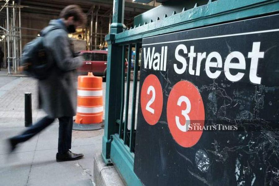 Wall Street ended higher on Tuesday as a spate of solid corporate earnings and upbeat forecasts stoked investor risk appetite and sparked a broad rally.