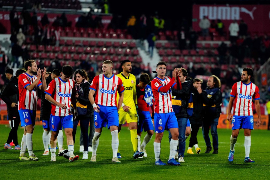 Girona's players celebrate victory at the end of the match against Alaves at the Montilivi stadium in Girona. - AFP PIC