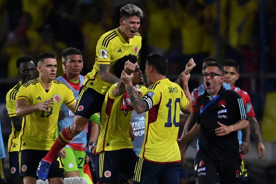 Colombia's forward Luis Diaz (C) celebrates with teammates after scoring against Brazil at the Roberto Melendez Metropolitan Stadium in Barranquilla, Colombia. - AFP PIC