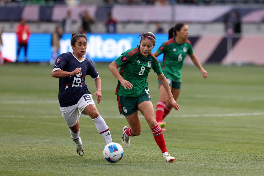 Mexico midfielder Alexia Delgado (8) and Paraguay forward Rebeca Fernandez (19) fight for the ball during the second half of the Concacaf W Gold Cup quaterfinal game at BMO Stadium. - REUTERS PIC