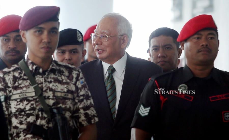 Datuk Seri Najib Razak seen arriving a the Kuala Lumpur Courts Complex on Dec 5 for his ongoing 1MDB trial. -NSTP/HAIRUL ANUAR RAHIM