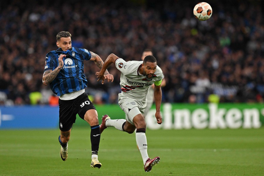 Atalanta's Gianluca Scamacca (L) fights for the ball with Bayer Leverkusen's Jonathan Tah (R) during the UEFA Europa League final at the Dublin Arena stadium, in Dublin. - AFP PIC