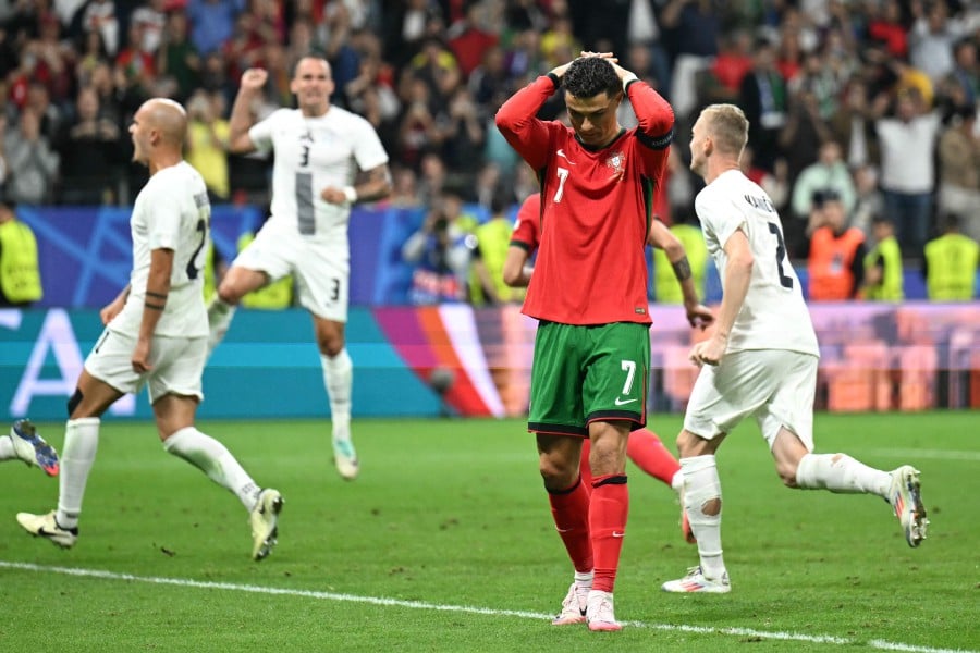  Portugal's forward Cristiano Ronaldo reacts after failing to score a penalty kick during the UEFA Euro 2024 round of 16 football match between Portugal and Slovenia at the Frankfurt Arena in Frankfurt. - AFP PIC