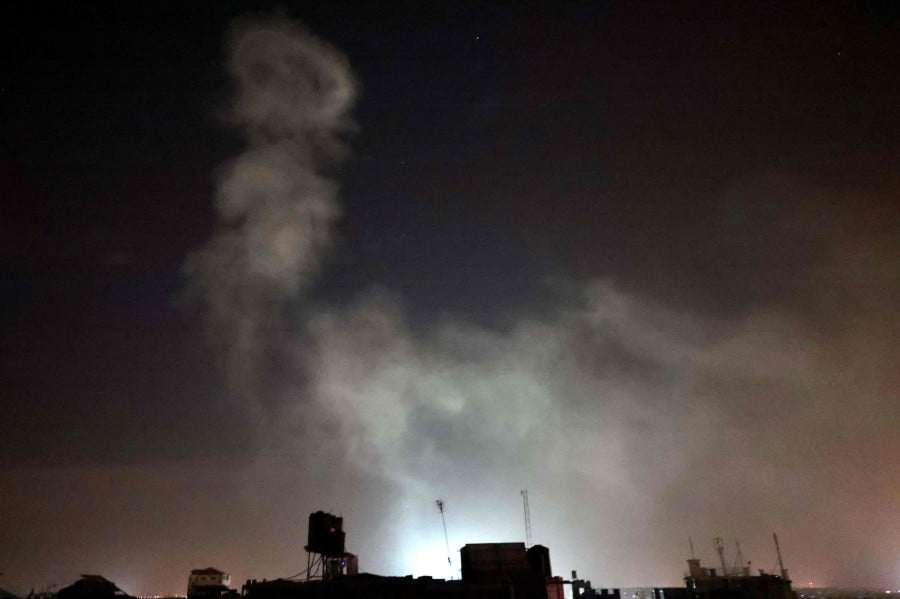 Smoke billows in the sky following Israeli air strikes on the Rafah refugee camp in the southern Gaza Strip. - AFP PIC