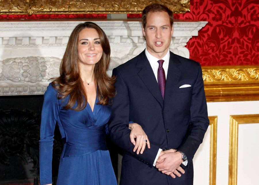 (FILE PHOTO) Britain's Prince William and Kate (left) pose for a photograph in St. James's Palace, central London. (REUTERS/Suzanne Plunkett)