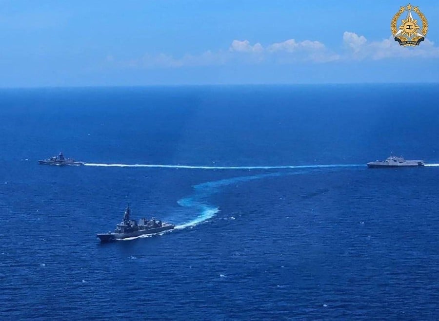 HMAS Warramunga, USS Mobile and JS Akebono maneuvering to form diamond formation during the first Multilateral Maritime Cooperative Activity between the Philippines, US, Australia and Japan, in South China Sea. - AFP PIC