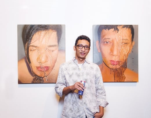 Winner of EhWauBulan Showcase, Abd Latif Maulan with his paintings The Principle III 2016 (left) and The Principle II 2016.