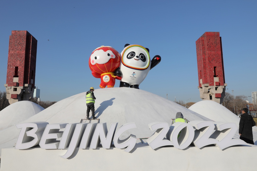 Chinese workers spray paint near the Bing Dwen Dwen, the Beijing 2022 Winter Olympic Mascot and Shuey Rhon Rhon, the 2022 Beijing Winter Paralympic Games Mascot, in Beijing, China, 11 January 2022. China is scheduled to host the Beijing 2022 Olympic and Paralympic Winter Games in February, making its capital the first city in the world to host both Summer (2008) and Winter Olympics (2022). - EPA pic
