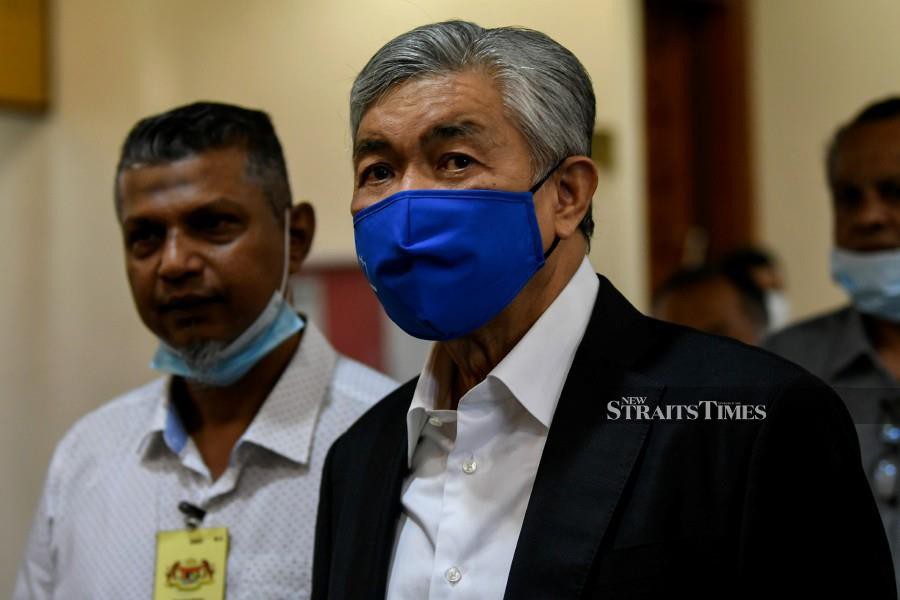 The trial of former deputy prime minister Datuk Seri Dr Ahmad Zahid Hamidi (right) involving the misappropriation of millions of ringgit from charity foundation Yayasan Akalbudi had to be adjourned today as a key witness was on medical leave. BERNAMA photo