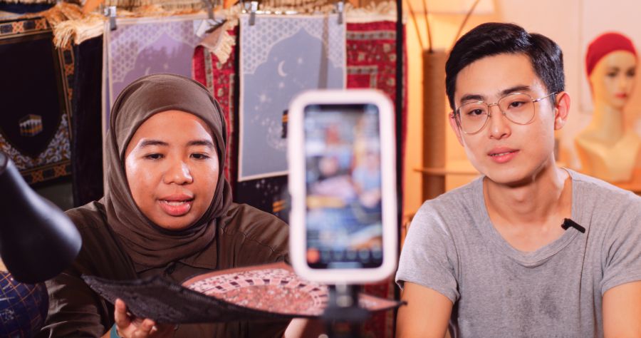 Wong (right), the founder of HomeDecoStore, one of the sellers featured in the documentary, seen here with his assistant Asmanissa Kamaruzaman during one of their live streaming sessions on Shopee. — Photo courtesy of Shopee