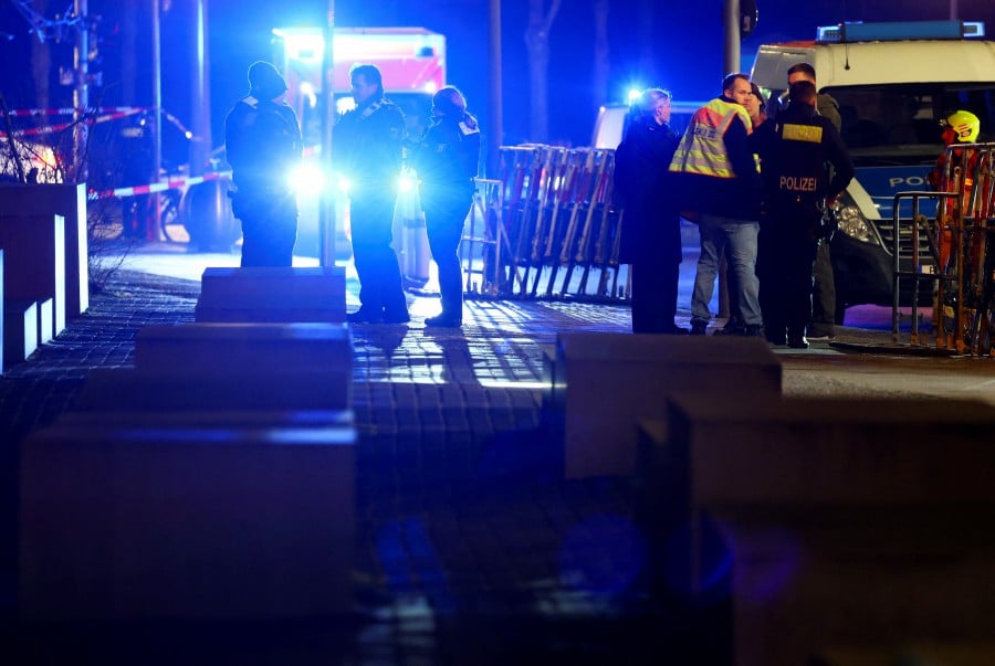 Security personnel gather after a suspected knife attack at the Holocaust Memorial, according to local media, in Berlin, Germany. - REUTERS PIC