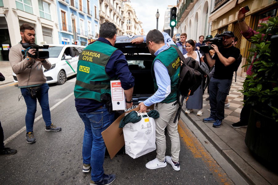 Spanish Civil Guard officers place boxes and bags in a car after completing a search of the home of former Spanish Football Federation chief Luis Rubiales, in Granada, Spain. - REUTERS PIC