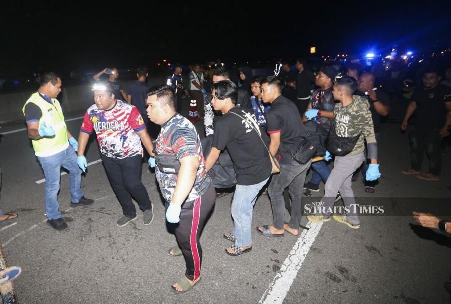 Three motorcyclists were killed in the crash at KM9.9 of the Ketereh-Kota Bharu Highway. - NSTP/Nik Abdullah Nik Omar