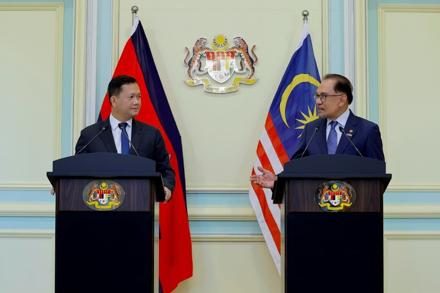 Prime Minister Datuk Seri Anwar Ibrahim (right) with his Cambodian counterpart speaking during a joint press conference at the Perdana Putra Building. - BERNAMA PIC