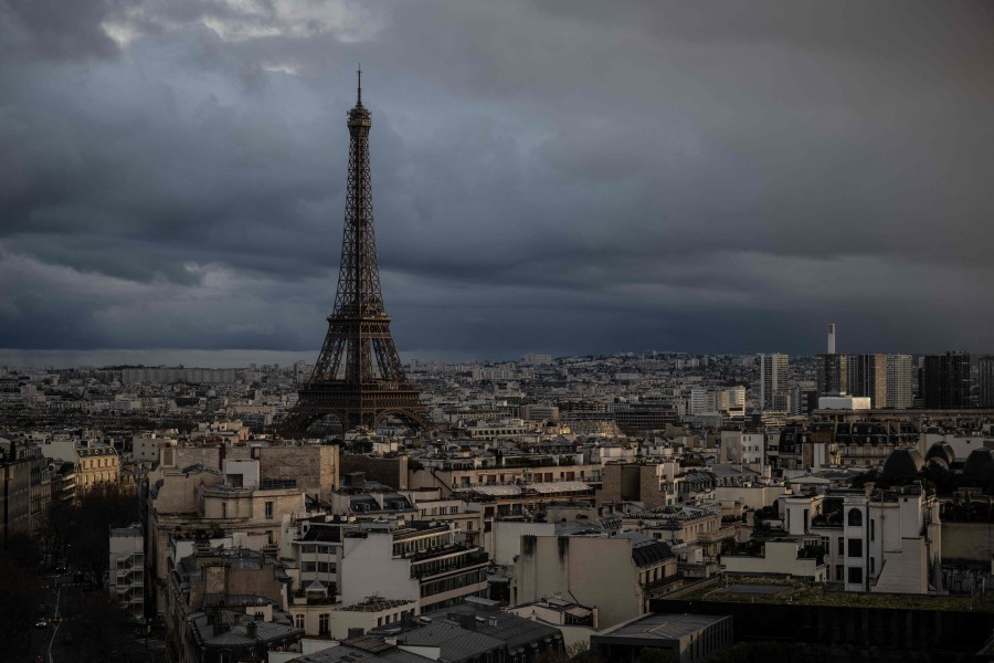 This photograph taken on February 23, 2024, shows the Eiffel Tower on a cloudy day in Paris. - AFP PIC