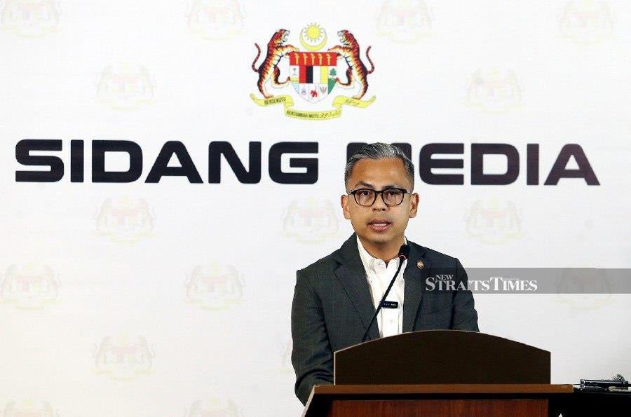 Communication Minister Fahmi Fadzil speaking to reporters duuring a press conference in Putrajaya. -NSTP/MOHD FADLI HAMZAH