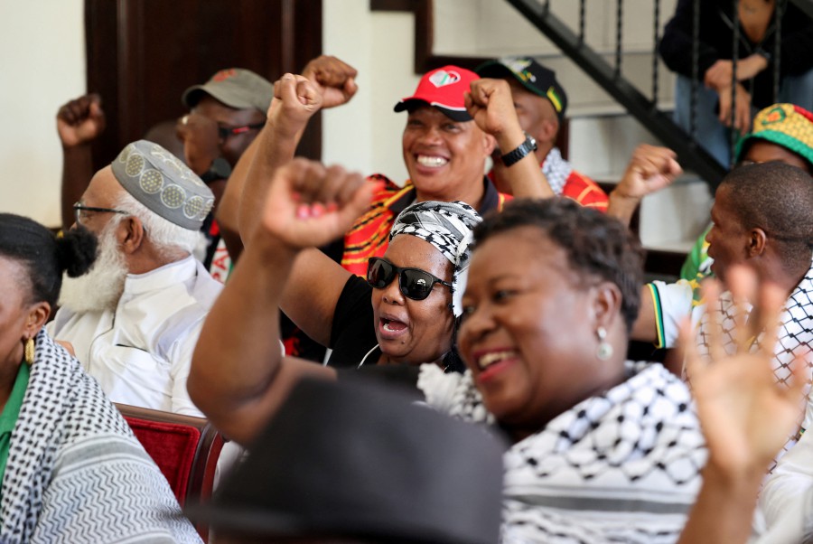 Pro-Palestinian supporters react to the judgement of the International Court of Justice (ICJ) in the Hague on emergency measures against Israel, following accusations by South Africa that the Israeli military operation in Gaza is a state-led genocide, at the headquarters of the Palestinian mission in Pretoria, South Africa. - AFP PIC