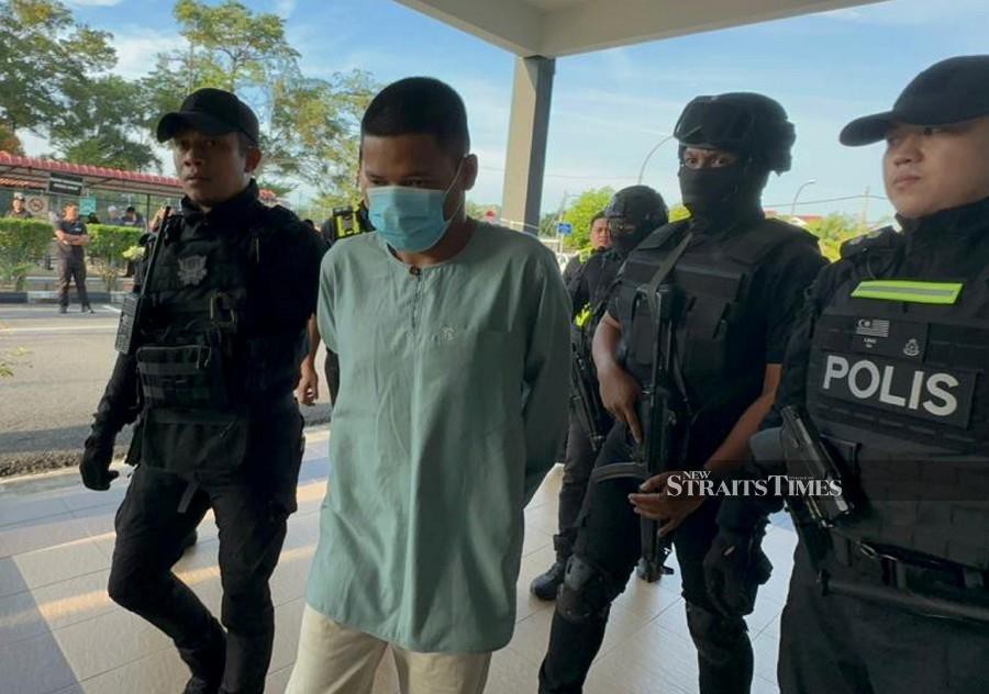 Mohammad Haikal Mahfuz is seen arriving at the Batu Pahat courts complex ahead of his trial. -NSTP/NUR AISYAH MAZALAN