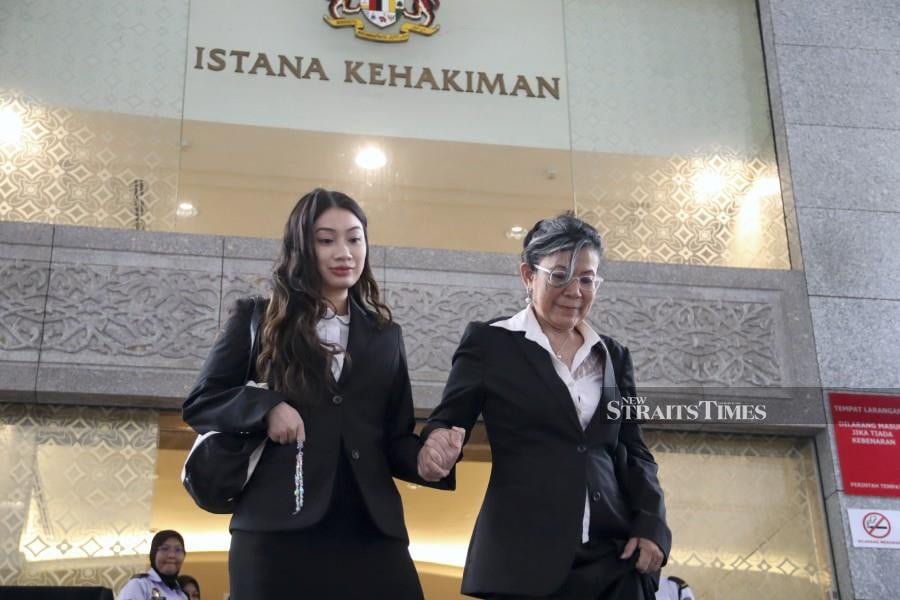Nik Elin Zurina Nik Abdul Rashid (right) and Tengku Yasmin Natasha Tengku Abdul Rahman seen leaving the Palace of Justice in Putrajaya on Feb 9 following the hearing. -NSTP/AIMAN DANIAL