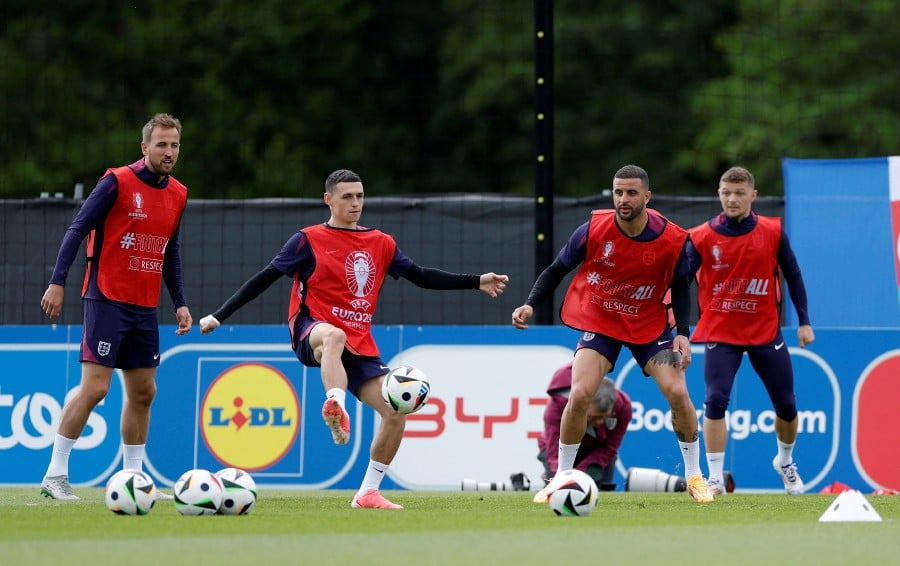 England's Harry Kane, Phil Foden and Kyle Walker during a training session in Blankenhain, Germany. -REUTERS PIC