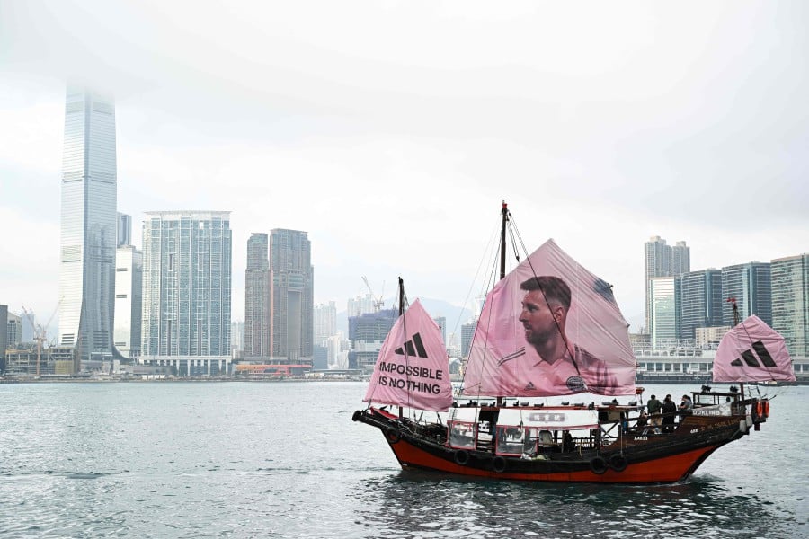 A junk with the face of Inter Miami CF Argentine forward Lionel Messi on its sail sails across Hong Kong’s Victoria Harbour on February 2, 2024, ahead of the friendly football match between Inter Miami CF and Hong Kong Team. - AFP PIC