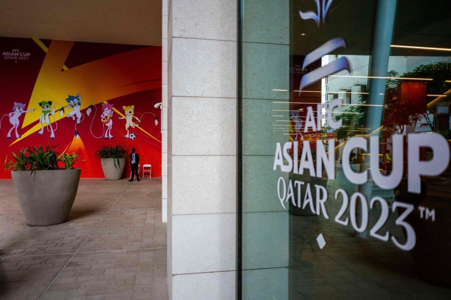 A sentinel guards an entrance of the Main Media Center (MMC) of the Asian Cup 2023 football tournament in Doha. - AFP PIC