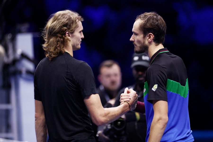 Russia's Daniil Medvedev shakes hands with Germany's Alexander Zverev after winning their group stage match at Pala Alpitour, Turin, Italy. - REUTERS PIC
