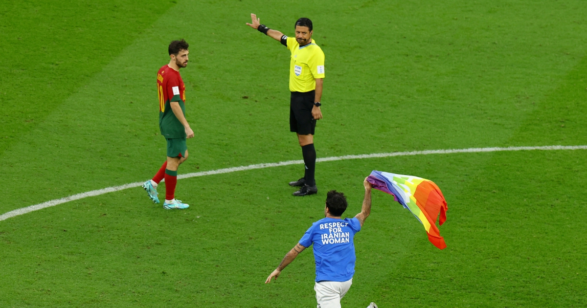 World Cup pitch invader flies rainbow flag and wears 'Save Ukraine