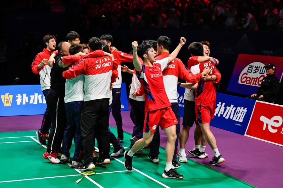 China’s team celebrates after winning against Indonesia at the men’s final match at the end of the Thomas and Uber Cup badminton tournament in Chengdu, at China’s southwest Sichuan province on May 5, 2024. -- AFP