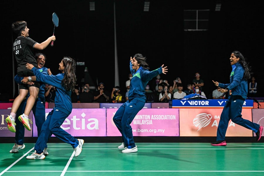 India's Anmol Kharb (left) celebrates after winning against Thailand's Pornpicha Choeikeewong in their women's singles final match at the 2024 Badminton Asia Team Championships in Selangor on February, 18, 2024. -- AFP