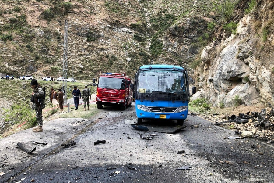 Five Chinese nationals working on a major dam construction site were killed along with their driver on March 26 when a suicide bomber targeted their vehicle in northwest Pakistan, officials said. -- Pic: AFP